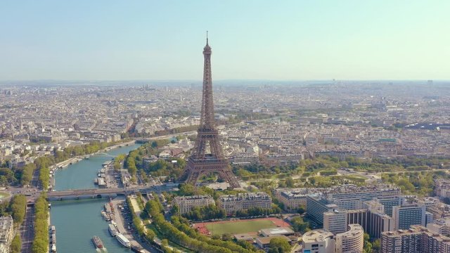 PARIS, FRANCE - MAY, 2019: Aerial drone view of Eiffel tower and Seine river in historical city centre from above.