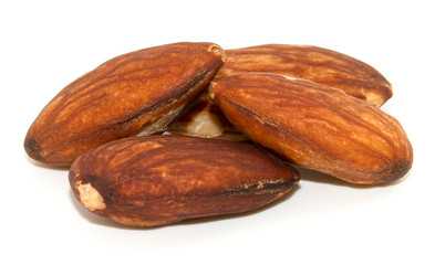 pile of almonds seeds isolated on white background
