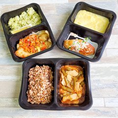 Useful food in disposable containers. Concept: proper nutrition, food delivery.