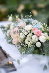 A bouquet of flowers. Around blurry objects.