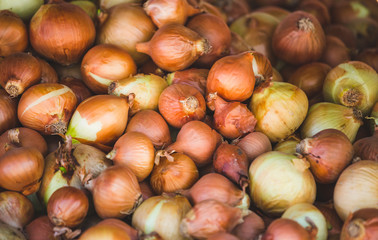 Onions on a market counter.
