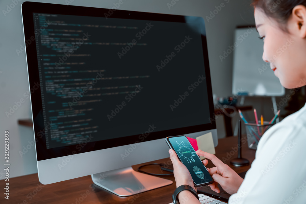 Poster businesswoman design applications on the smartphone and test performance before sending to customers