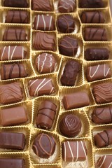 chocolate candy set close-up.assorted chocolate sweets.Chocolate candies set in an open box. top view.sweet dessert closeup.gift box.Details sweets praline chocolate 