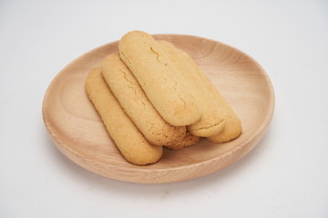 Cookies on a white ceramic plate on the gray kitchen table. Top view with copy space.Chocolate chip cookies isolated on a white background. Cookies homemade cakes.
