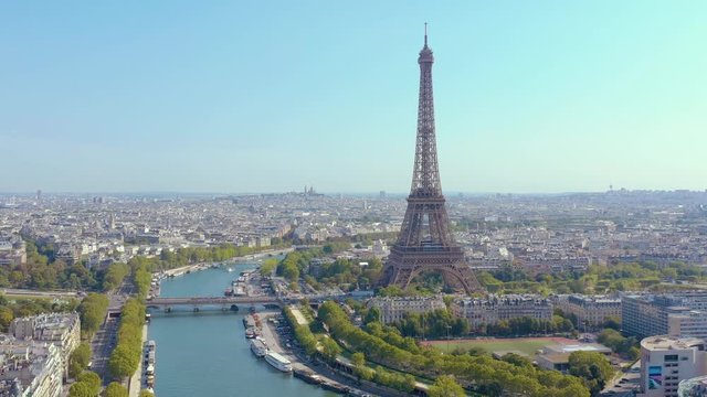PARIS, FRANCE - MAY, 2019: Aerial drone view of Eiffel tower and Seine river in historical city centre from above.