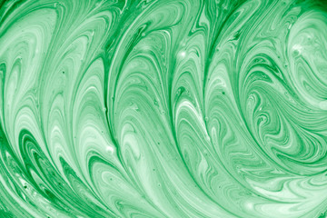 Pattern of liquid green paint. Abstract background.
