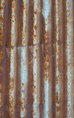 The surface of the old metal wall with rusted steel