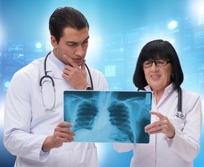 Two doctors discussing x-ray image in telemedicine concept