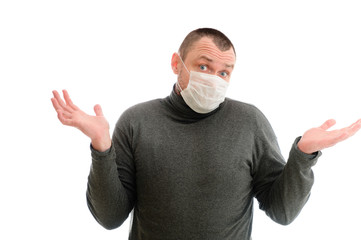 Concept isolate Caucasian man shows emotions with hands in a medical mask in a gray jacket on a white background
