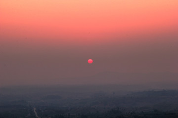 The blurred abstract background of the sun reversing the horizon in the mountains, colorful change over time, the beauty of seasonal nature