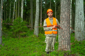 Forest engineer Works in the forest. The forester measures the diameter of the tree. Forestry and reforestation. Professional people.