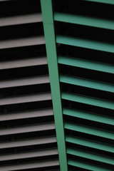 texture made with green and gray cylinders, lines converging 