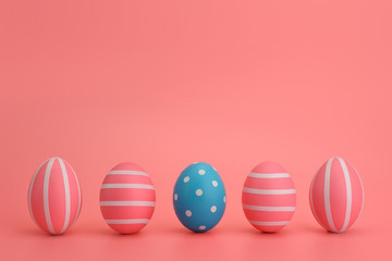 Five Easter blue and pink eggs with white stripes on a pink background. Eggs in a line. Colourful Easter concept. Place for text, copy space. Isolated. Easter card, banner, design.
