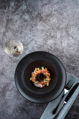 Salmon tartare with avocado and special chef's sauce with white wine and soy sauce