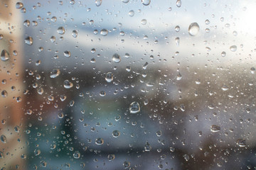 wet window after rain on the background of the rising sun. beautiful spring weather