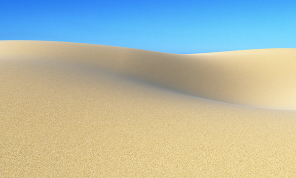 Smooth sand dunes under clear blue sky
