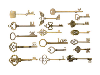 old brass key against a white background
