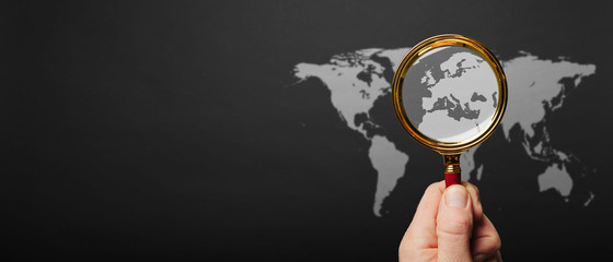 a world map on grey paper background