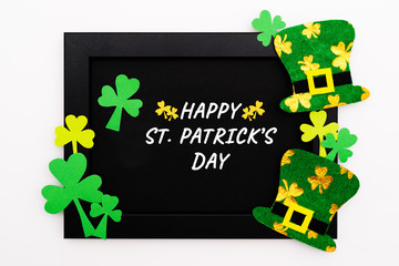 St Patricks day, festive leprechaun hat and green Shamrocks on photo frame