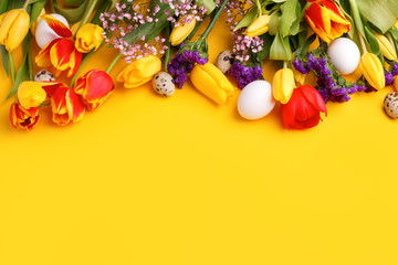 Fototapeta na wymiar Springtime season greeting card - happy easter concept - multicolored tulips and eggs on bright yellow background, copy space, sale, discount, celebrate banner