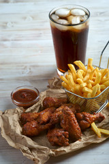 grilled BBQ wings with French fries and Cola