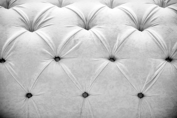 White velours background on the back of the sofa