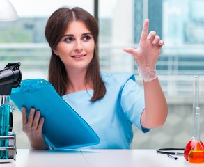 Young female doctor working in the lab