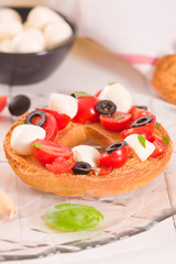 Friselle with tomatoes and mozzarella cheese.