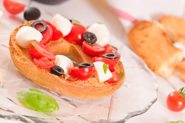 Friselle with tomatoes and mozzarella cheese.