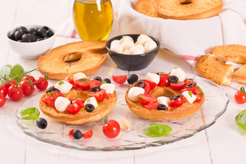 Friselle with tomatoes and mozzarella cheese.