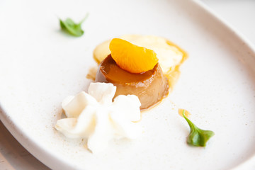 Coffee pudding served with whipped cream and passion fruit mousse