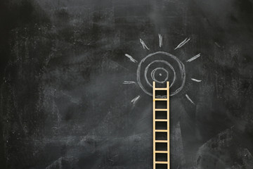 wooden ladder and sun info graphics over blackboard background