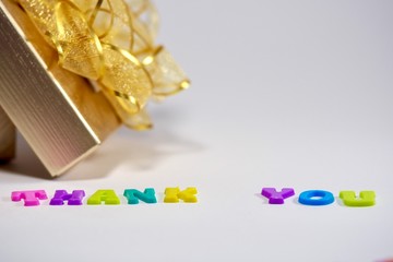 christmas gift box with golden ribbon