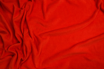 Fleece fabric red top view. Texture of textile fleece bedspread. © fizke7