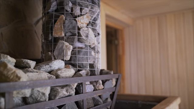 Close-up of natural gray rough stone for sauna. Can be used as a background. Stones in the sauna