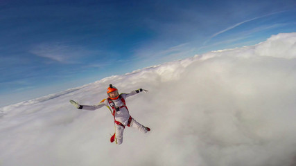 Expression. Skydiving makes people confident. Flying in the clouds.