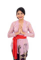 Balinese woman wearing traditional clothes with gestures welcoming