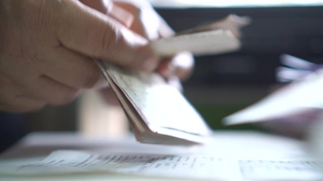 Weak baht, Thai baht banknotes, Businessman's hands counting money. one thousand baht. (THB) is official currency of Thailand. Finance and banking business in Asia, impact of global economy from virus