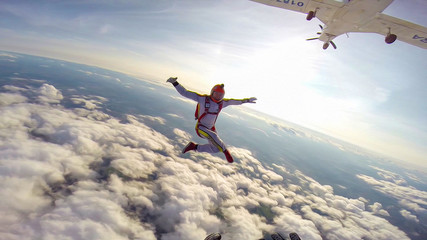 Looking. Extreme athletes conquer the sky. Height for skydiving. A sense of weightlessness and freedom