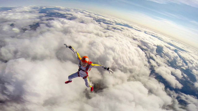 Looking. Extreme athletes conquer the sky. Height for skydiving. A sense of weightlessness and freedom
