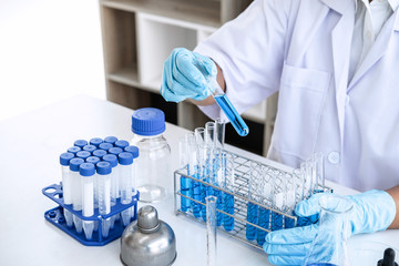 Scientist or medical in lab working in biotechnological laboratory using equipment for research...