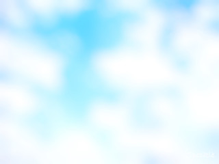 Blurred blue sky with clouds for background.
