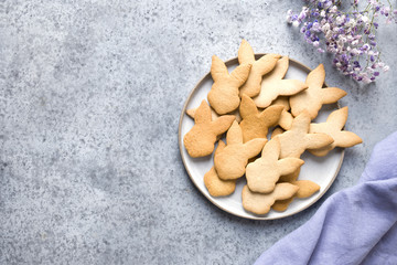 Easter cookies on grey stone background. Top view with copy space.
