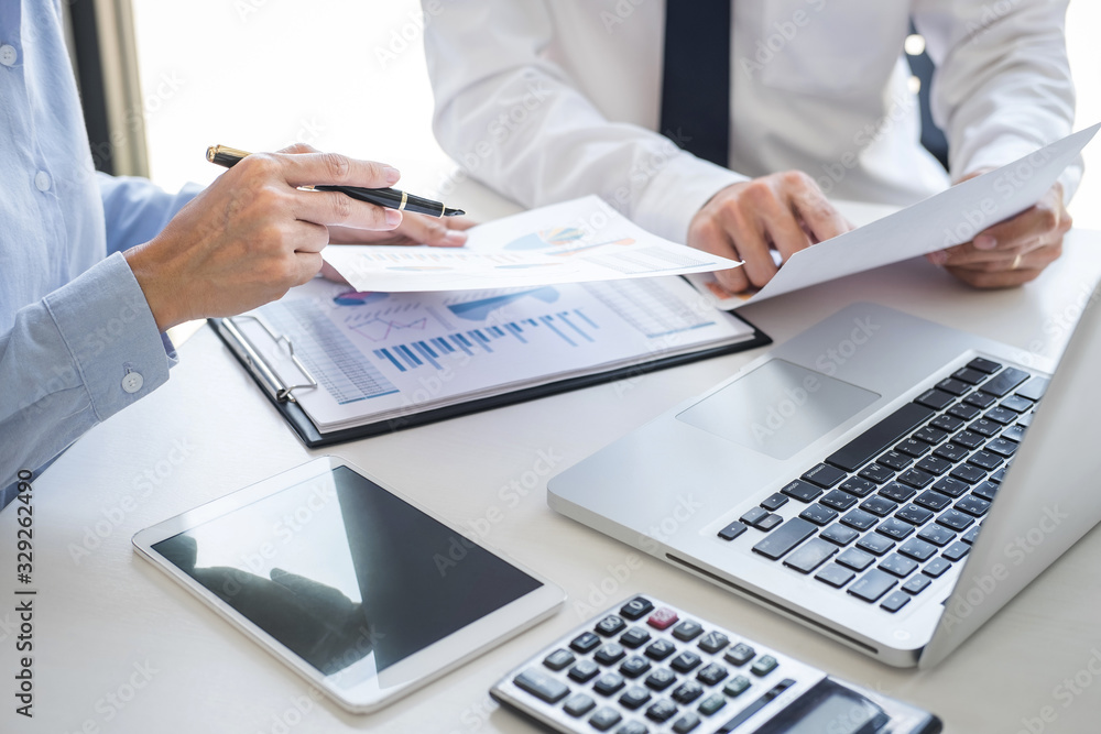 Fototapete Business team colleagues discussing working analyzing with financial data and marketing growth report graph in team consultation to grow up profit, Meeting Talking Brainstorming Communication Concept