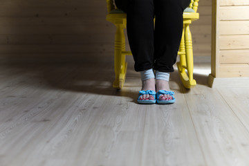 Woman sitting on yellow chair 