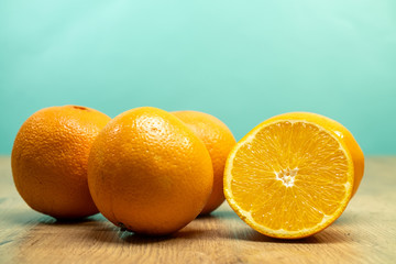fresh oranges on wooden table