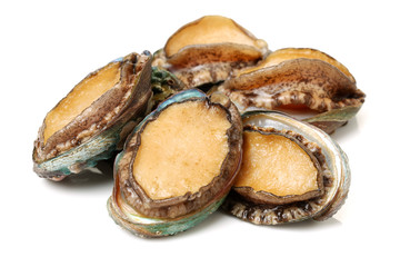 Raw abalones on the white background 