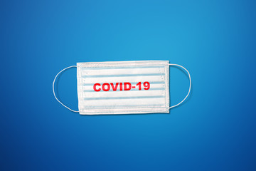 Blue Medical Disposable Face Mask with covid-19 . Covid-19  Coronavirus COVID-19. Disposable breath...