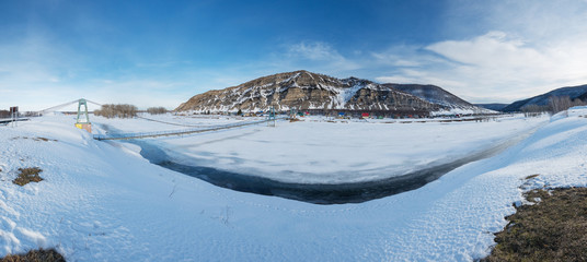 South Urals. The road to the cave Kinderlinskaya. View of the Ukly Kaya rock and the village of Tash-asty.