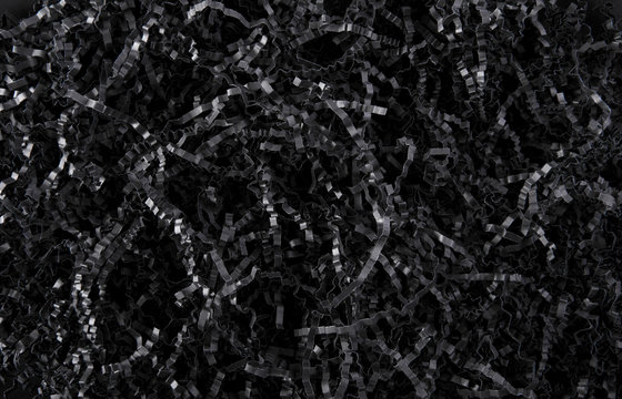 Black color shredded paper - gift box filler background.
